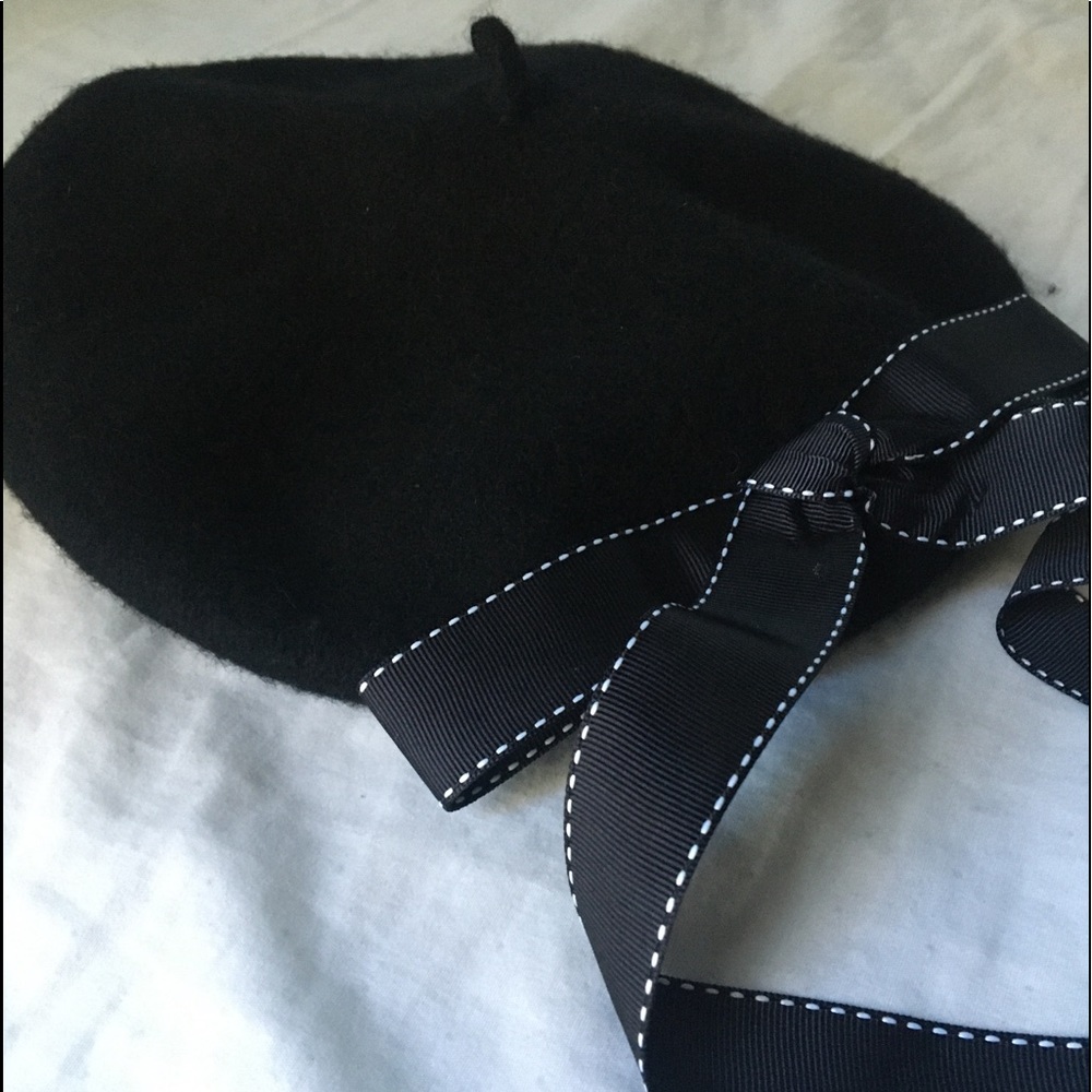 Beautiful black beret with black bow accent
